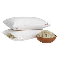 Two white swan shimul tula pillows with a bowl of shimul tula on a white background