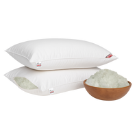 Two white super micro fiber pillows with a bowl of white super micro fiber on a white background