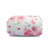 Floral-patterned comforter on a white background