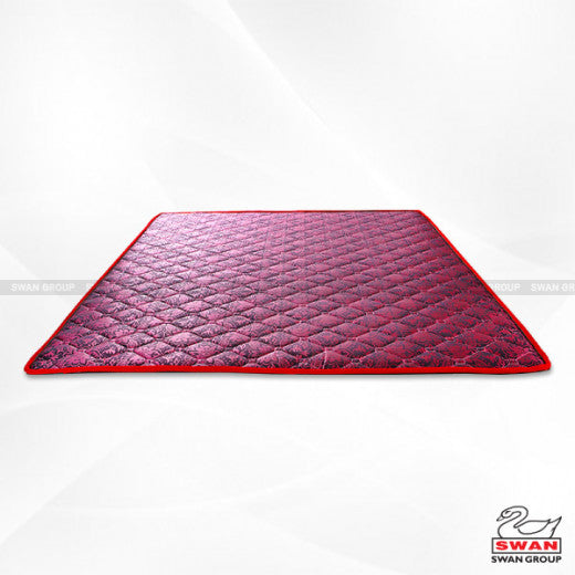 Quilted red mattress padding with a white background